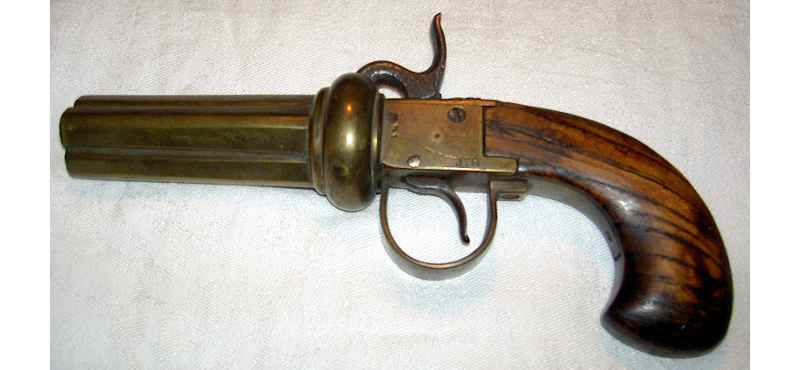 Percussion revolver, four shots, Jack's initials etched on the housing.