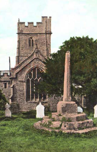 St George's, Bicknoller, the decrepit stone cross at the back of the church has been repaired with a cross added to the top.