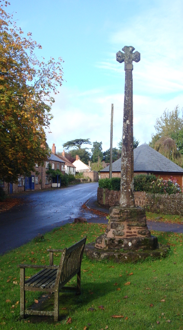 Medieval cross of red sandstone, Crowcombe. This is roughly the view Kate would have had after stopping by the cross and looking back at the inn.